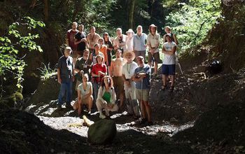 group of scientists in the forest